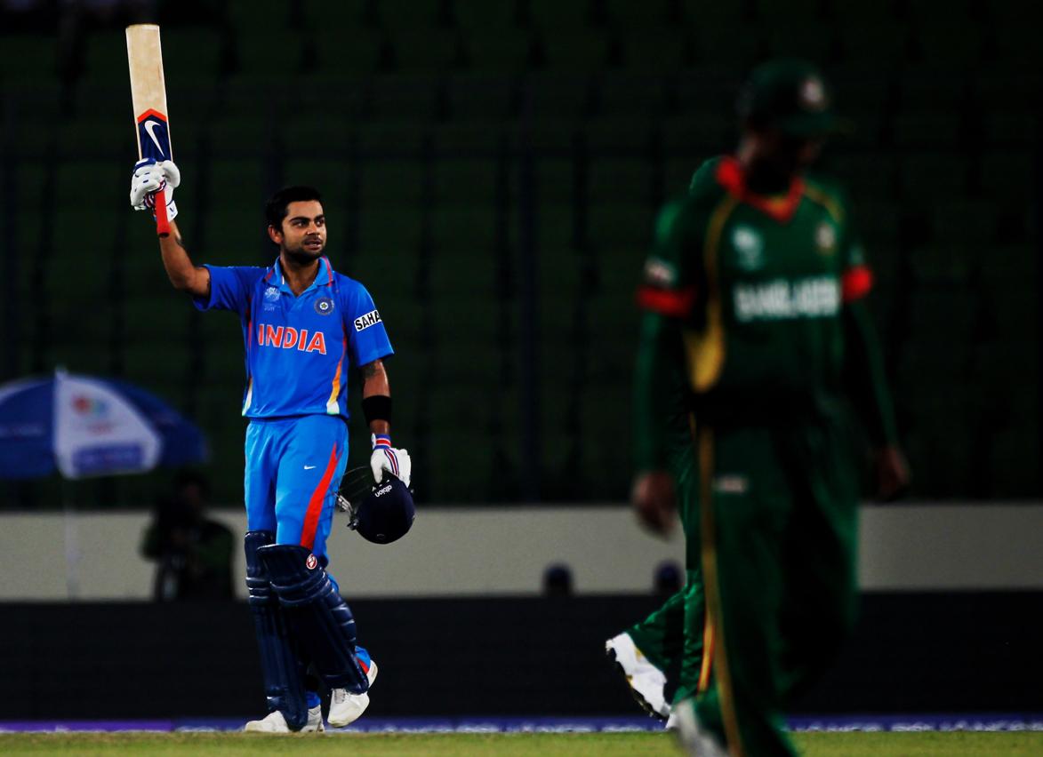 Virat Kohli of India raises his bat on reaching his century during the opening game of the ICC Cricket World Cup between Bangladesh and India at the Shere-e-Bangla National Stadium on February 19, 2011 in Dhaka, Bangladesh.(Getty) Virat Kohli of India raises his bat on reaching his century during the opening game of the ICC Cricket World Cup between Bangladesh and India at the Shere-e-Bangla National Stadium on February 19, 2011 in Dhaka, Bangladesh.(Getty)