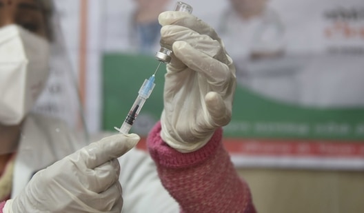 Kamlesh Kumari, a woman in her 50s, was administered with both doses of Covid-19 vaccine in one-go at a primary health centre in Akbarpur area of Kanpur Dehat district. The health worker who was involved in this mishap was reportedly on a phone call when the incident happened. (Deepak Gupta/Hindustan Times/For Representative Purposes Only)