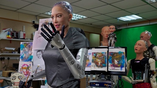 Sophia uses a brush to paint at Hanson Robotics studio in Hong Kong on March 29, 2021. (AP Photo ) Sophia uses a brush to paint at Hanson Robotics studio in Hong Kong on March 29, 2021. (AP Photo )