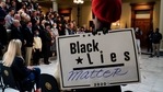 A person wears a "Black Lies Matter" sign as Georgia Governor Brian Kemp speaks during a news conference on Saturday about Major League Baseball's decision to pull the 2021 All-Star Game from Atlanta over a new voting law. (AP Photo/Brynn Anderson) A person wears a "Black Lies Matter" sign as Georgia Governor Brian Kemp speaks during a news conference on Saturday about Major League Baseball's decision to pull the 2021 All-Star Game from Atlanta over a new voting law. (AP Photo/Brynn Anderson)