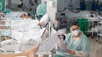 Healthcare workers treat patients inside a Covid-19 ICU at a field hospital in the Heliopolis favela of Sao Paulo, Brazil.(Bloomberg) Healthcare workers treat patients inside a Covid-19 ICU at a field hospital in the Heliopolis favela of Sao Paulo, Brazil.(Bloomberg)