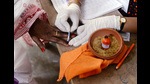 A polling officer marks a voter's finger at a polling station of Midnapur town during the first phase of the assembly election, West Midnapore (ANI) A polling officer marks a voter's finger at a polling station of Midnapur town during the first phase of the assembly election, West Midnapore (ANI)
