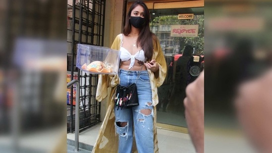 Ileana flaunted her washboard abs as she stepped out in a white spaghetti strap bralette with a knot detail in the front.(Varinder Chawla)