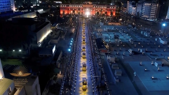 Vehicles move in a convoy during the Pharaohs’ Golden Parade in Cairo on April 3. The convoy transported 18 kings and four queens, mostly from the New Kingdom, from the Egyptian Museum in central Cairo's Tahrir Square to the National Museum of Egyptian Civilization in Fustat, about 5km to the south-east.(Host Broadcaster via REUTERS)