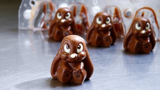 Chocolate Easter bunnies are seen after taking them out of the mould during production at Eric's Confiserie Baumann in Zurich, Switzerland.(REUTERS)
