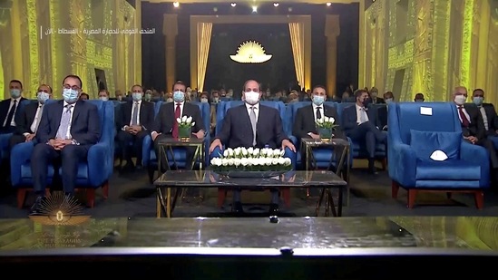 Egypt's President Abdel-Fattah al-Sisi attends the Pharaohs’ Golden Parade in Cairo on April 3. As the royal mummies arrived at the museum, which was officially inaugurated on April 3, cannons fired a 21-gun salute and President Abdel Fattah al-Sisi stood by as the mummies filed past on vehicles bedecked with golden pharaonic motifs, Reuters reported.(Host Broadcaster via REUTERS)