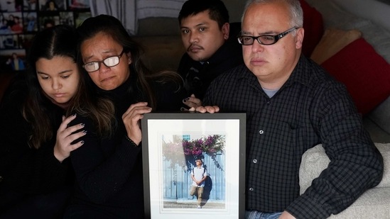 Cassandra Quinto-Collins, second from left, holds a photo of her son, Angelo Quinto, while sitting with daughter Bella Collins, left, son Andrei Quinto, center, and husband Robert Collins during an interview in Antioch.(AP) Cassandra Quinto-Collins, second from left, holds a photo of her son, Angelo Quinto, while sitting with daughter Bella Collins, left, son Andrei Quinto, center, and husband Robert Collins during an interview in Antioch.(AP)