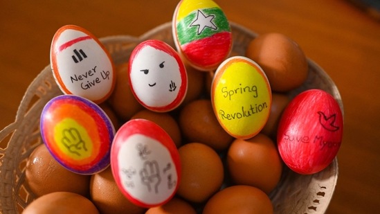 Eggs, decorated with messages in support of protesters demonstrating against the military coup, are displayed in Yangon's Mingalar Taungnyunt township to coincide with Easter Sunday. (AFP) Eggs, decorated with messages in support of protesters demonstrating against the military coup, are displayed in Yangon's Mingalar Taungnyunt township to coincide with Easter Sunday. (AFP)