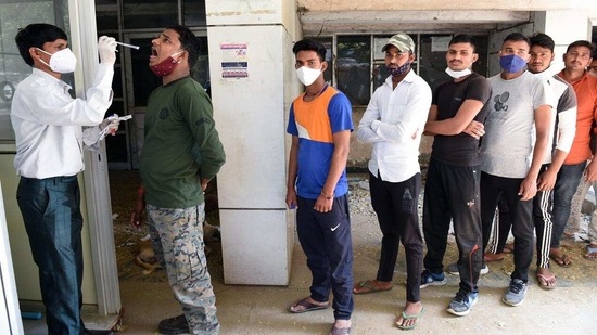 The new SOPs also permit action against violators. In picture - People in a queue for the Covid-19 test. (ANI) The new SOPs also permit action against violators. In picture - People in a queue for the Covid-19 test. (ANI)