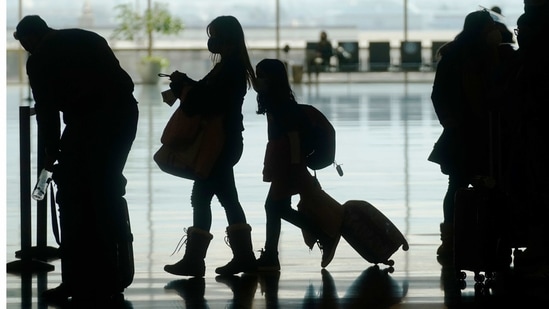 Travelers walk through the Salt Lake City International Airport.(AP) Travelers walk through the Salt Lake City International Airport.(AP)