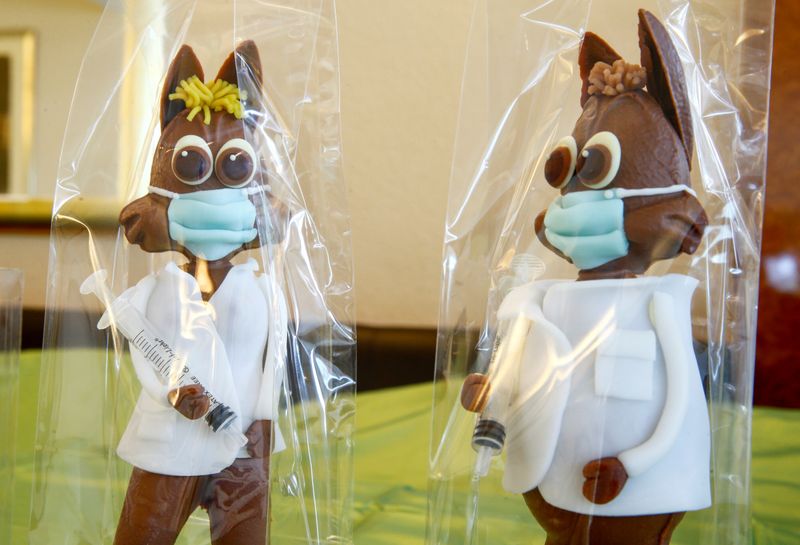 FILE PHOTO: Chocolate Easter bunnies decorated as doctor and nurse (R) holding syringes are displayed at Eric's Confiserie Baumann, as the spread of the coronavirus (COVID-19) continues, in Zurich, Switzerland. (REUTERS)