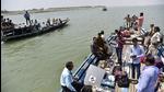 Poll officials take EVMs and other election material to remote areas on boats on the eve of the third phase of assembly elections in Kamrup on Monday. (ANI) Poll officials take EVMs and other election material to remote areas on boats on the eve of the third phase of assembly elections in Kamrup on Monday. (ANI)