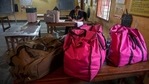 Polling officials make preparations at a polling station on the eve of third phase of assembly election, in Assam's Guwahati on Monday.(AP Photo) Polling officials make preparations at a polling station on the eve of third phase of assembly election, in Assam's Guwahati on Monday.(AP Photo)