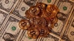 Representations of virtual currency Bitcoin and US dollar banknotes are seen in this picture illustration. (Reuters) Representations of virtual currency Bitcoin and US dollar banknotes are seen in this picture illustration. (Reuters)