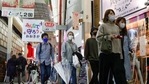 People wearing face masks to help curb the spread of the coronavirus walk at Umeda's downtown area in Osaka, western Japan, Sunday, April 4, 2021. (AP) People wearing face masks to help curb the spread of the coronavirus walk at Umeda's downtown area in Osaka, western Japan, Sunday, April 4, 2021. (AP)