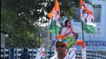 A TMC supporter rides a scooty with a cut-out of West Bengal chief minister Mamata Banerjee and party flags in Kolkata. (ANI) A TMC supporter rides a scooty with a cut-out of West Bengal chief minister Mamata Banerjee and party flags in Kolkata. (ANI)