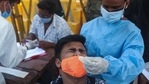 A health worker takes a nasal swab sample of a man to test for COVID-19 in Mumbai, India, Monday, April 5, 2021. India reported its biggest single-day spike in confirmed coronavirus cases since the pandemic began Monday, and officials in the hard-hit state home to Mumbai are returning to the closure of some businesses and places of worship in a bid to slow the spread. (AP Photo/Rafiq Maqbool)(AP) A health worker takes a nasal swab sample of a man to test for COVID-19 in Mumbai, India, Monday, April 5, 2021. India reported its biggest single-day spike in confirmed coronavirus cases since the pandemic began Monday, and officials in the hard-hit state home to Mumbai are returning to the closure of some businesses and places of worship in a bid to slow the spread. (AP Photo/Rafiq Maqbool)(AP)