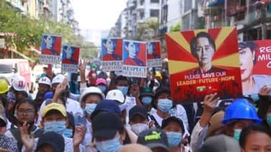 Anti-coup protesters hold up images of deposed leader Aung San Suu Kyi as they gather in Yangon, Myanmar. Anti-coup protesters hold up images of deposed leader Aung San Suu Kyi as they gather in Yangon, Myanmar.