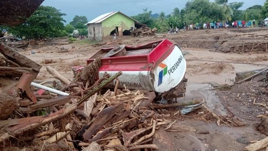 A damaged truck is seen in an area affected by flash floods after heavy rains in East Flores, East Nusa Tenggara province, Indonesia April 4, 2021, (INDONESIA OUT Via REUTERS)