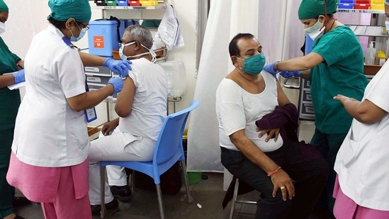 A medic injects a COVID-19 vaccine to people, at Nair Hospital in Dadar. A medic injects a COVID-19 vaccine to people, at Nair Hospital in Dadar.