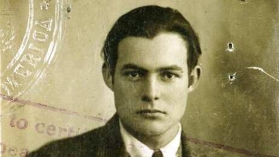This 1920s photo provided by the John F. Kennedy Library Foundation from the Ernest Hemingway Collection shows Ernest Hemingway in his U.S. passport photo. A new three-part documentary about Hemingway, which relied heavily on the archives at the John F. Kennedy Presidential Library and Museum in Boston, debuts April 5, 2021, on PBS (AP) This 1920s photo provided by the John F. Kennedy Library Foundation from the Ernest Hemingway Collection shows Ernest Hemingway in his U.S. passport photo. A new three-part documentary about Hemingway, which relied heavily on the archives at the John F. Kennedy Presidential Library and Museum in Boston, debuts April 5, 2021, on PBS (AP)