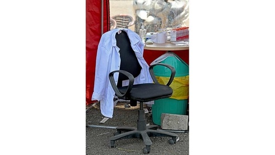 A lab coat of a health worker is seen on a chair at a booth conducting RT-PCR based Covid-19 tests, in Mumbai, on April 5. Having added 73,301 new cases a day over the week till April 3, India has surpassed Brazil’s average tally of 66,176 and US’s 65,624 to become the biggest current Covid-19 hot spot, HT reported.(Indranil Mukherjee / AFP)