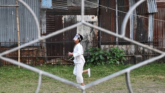 Children wearing protective face-shields amid concerns over the spread of the Covid-19. (AFP) Children wearing protective face-shields amid concerns over the spread of the Covid-19. (AFP)