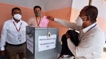 A polling official casts a postal vote for the Assam Assembly elections at a polling station, in Guwahati on Monday. (ANI Photo) A polling official casts a postal vote for the Assam Assembly elections at a polling station, in Guwahati on Monday. (ANI Photo)