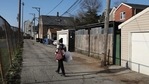 A person walks through an alley days after a fatal shooting of a 13-year-old boy by a Chicago Police officer in Chicago.(AP) A person walks through an alley days after a fatal shooting of a 13-year-old boy by a Chicago Police officer in Chicago.(AP)