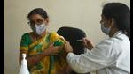 A health worker administers a Covid-19 vaccine. (HT Photo) A health worker administers a Covid-19 vaccine. (HT Photo)