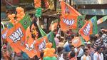 BJP activists with party flags in Kolkata. (PTI) BJP activists with party flags in Kolkata. (PTI)