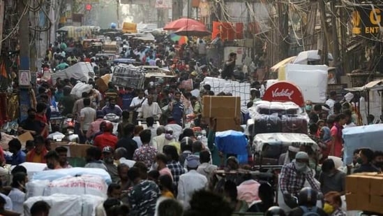 People walk at a crowded market amidst the spread of the coronavirus disease (Covid-19), in the old quarters of Delhi, India, April 6, 2021. (Reuters)