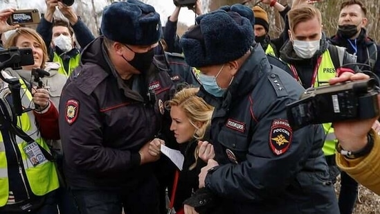 Russian police officers detain Anastasiya Vasilyeva, a doctor and ally of Kremlin critic Alexei Navalny, near the IK-2 corrective penal colony, where Navalny serves his jail term, in the town of Pokrov, Russia. (Reuters)