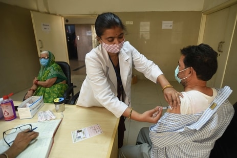 A health worker administers a Covid-19 vaccine, at Sector 30 District Hospital, in Noida. (Sunil Ghosh / Hindustan Times) A health worker administers a Covid-19 vaccine, at Sector 30 District Hospital, in Noida. (Sunil Ghosh / Hindustan Times)