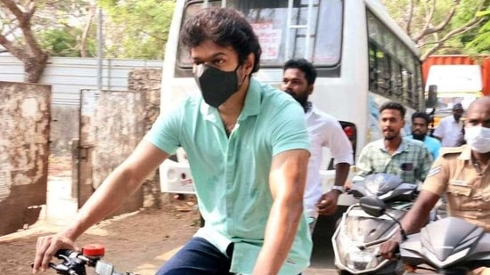 Actor Vijay rides a bicycle to the polling booth as he arrives to cast his vote during the assembly elections in Chennai on Tuesday. (ANI Photo)