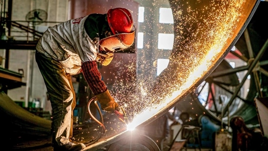 Sparks fly up as a worker produces engineering equipment for export at a factory in Nantong in China's eastern Jiangsu province. (AFP) Sparks fly up as a worker produces engineering equipment for export at a factory in Nantong in China's eastern Jiangsu province. (AFP)