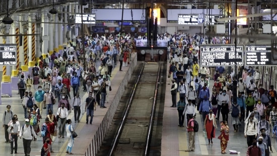 Commuters wait to board suburban trains at Chhatrapati Shivaji Maharaj Terminus in Mumbai. (AP Photo) Commuters wait to board suburban trains at Chhatrapati Shivaji Maharaj Terminus in Mumbai. (AP Photo)