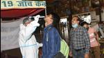 A medic collect swab samples of passengers for Covid-19 testing at Patna Junction on April 4. (Santosh Kumar /Hindustan Times) A medic collect swab samples of passengers for Covid-19 testing at Patna Junction on April 4. (Santosh Kumar /Hindustan Times)
