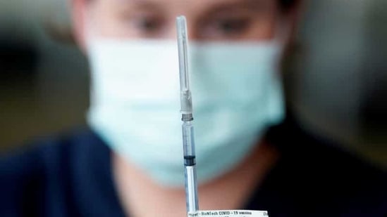 A healthcare professional prepares a dose of the Pfizer coronavirus disease (Covid-19) vaccine in Melbourne, Australia.(Reuters)
