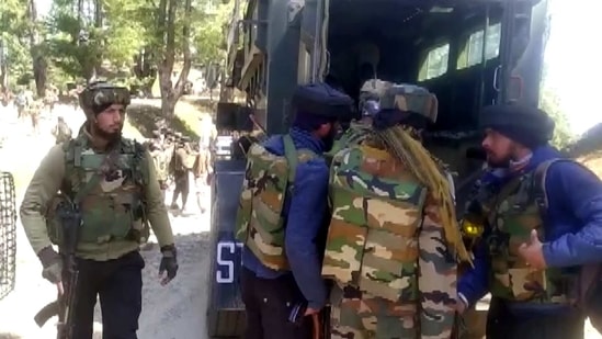 Police and Army carry out an encounter at a forest in the Peer Ki Gali area of Shopian district on Saturday. (ANI Photo)