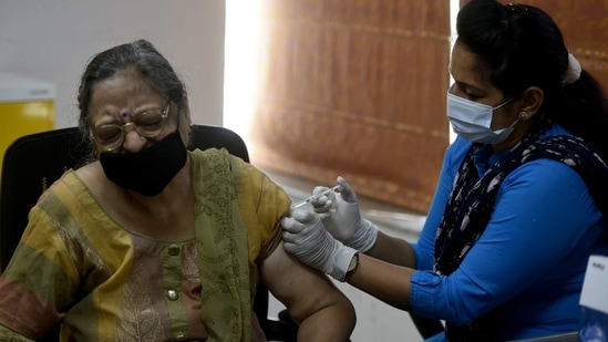 A woman gets a Covid-19 vaccine shot at a vaccination camp in Manesar, on Wednesday. (ANI Photo) A woman gets a Covid-19 vaccine shot at a vaccination camp in Manesar, on Wednesday. (ANI Photo)
