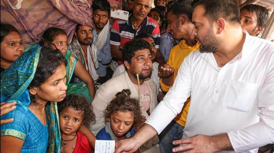 Madhubani : Rashtriya Janta Dal leader Tejashwi Prasad Yadav meets families of those murdered in Madhubani district, Tuesday. (PTI) Madhubani : Rashtriya Janta Dal leader Tejashwi Prasad Yadav meets families of those murdered in Madhubani district, Tuesday. (PTI)