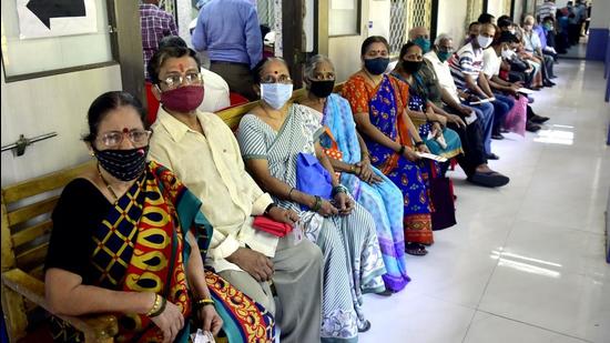People wait to get vaccinated against Covid-19 at Poddar Hospital, in Mumbai, India, on Tuesday, April 6. (Anshuman Poyrekar/HT Photo)