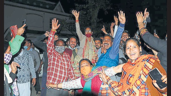 Congress workers celebrate the victory of their candidates in Dharamshala on Wednesday. (HT Photo)
