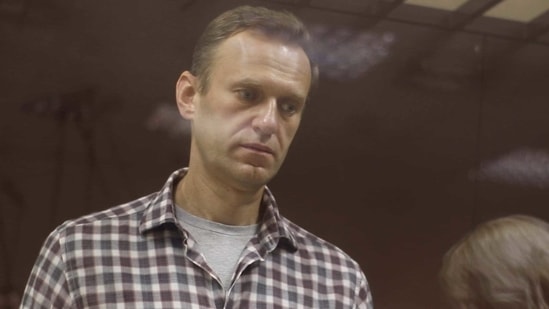 Kremlin critic Alexei Navalny, who is accused of slandering a Russian World War Two veteran, stands inside a defendant dock during a court hearing in Moscow, Russia. (Reuters) Kremlin critic Alexei Navalny, who is accused of slandering a Russian World War Two veteran, stands inside a defendant dock during a court hearing in Moscow, Russia. (Reuters)