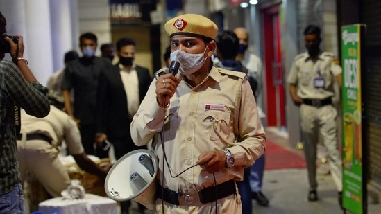 New Delhi: Security personnel during night curfew, imposed by Delhi government to curb COVID-19 spread, at Connaught Place in New Delhi, Tuesday, April 6, 2021. (PTI Photo/Ravi Choudhary(PTI04_06_2021_000373B) (PTI) New Delhi: Security personnel during night curfew, imposed by Delhi government to curb COVID-19 spread, at Connaught Place in New Delhi, Tuesday, April 6, 2021. (PTI Photo/Ravi Choudhary(PTI04_06_2021_000373B) (PTI)