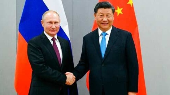 FILE - In this Nov. 12, 2019, file photo, Russian President Vladimir Putin, left, and China's President Xi Jinping shake hands prior to their talks on the sideline of the 11th edition of the BRICS Summit, in Brasilia, Brazil. Putin and Xi have developed strong personal ties helping bolster a “strategic partnership” between the two former Communist rivals. (Ramil Sitdikov/Sputnik, Kremlin/Pool Photo via AP, File) (AP) FILE - In this Nov. 12, 2019, file photo, Russian President Vladimir Putin, left, and China's President Xi Jinping shake hands prior to their talks on the sideline of the 11th edition of the BRICS Summit, in Brasilia, Brazil. Putin and Xi have developed strong personal ties helping bolster a “strategic partnership” between the two former Communist rivals. (Ramil Sitdikov/Sputnik, Kremlin/Pool Photo via AP, File) (AP)
