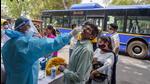 A health worker takes sample from a man for Covid-19 test in New Delhi on Wednesday, April 7. (PTI) A health worker takes sample from a man for Covid-19 test in New Delhi on Wednesday, April 7. (PTI)