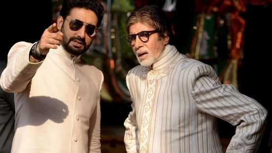 Amitabh Bachchan and Abhishek Bachchan caught in a candid moment.