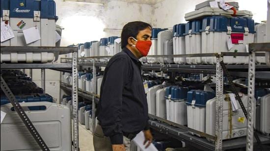 An election official checks Electronic Voting Machines (EVMs) in a strong room on counting day. (PTI/File Picture) An election official checks Electronic Voting Machines (EVMs) in a strong room on counting day. (PTI/File Picture)